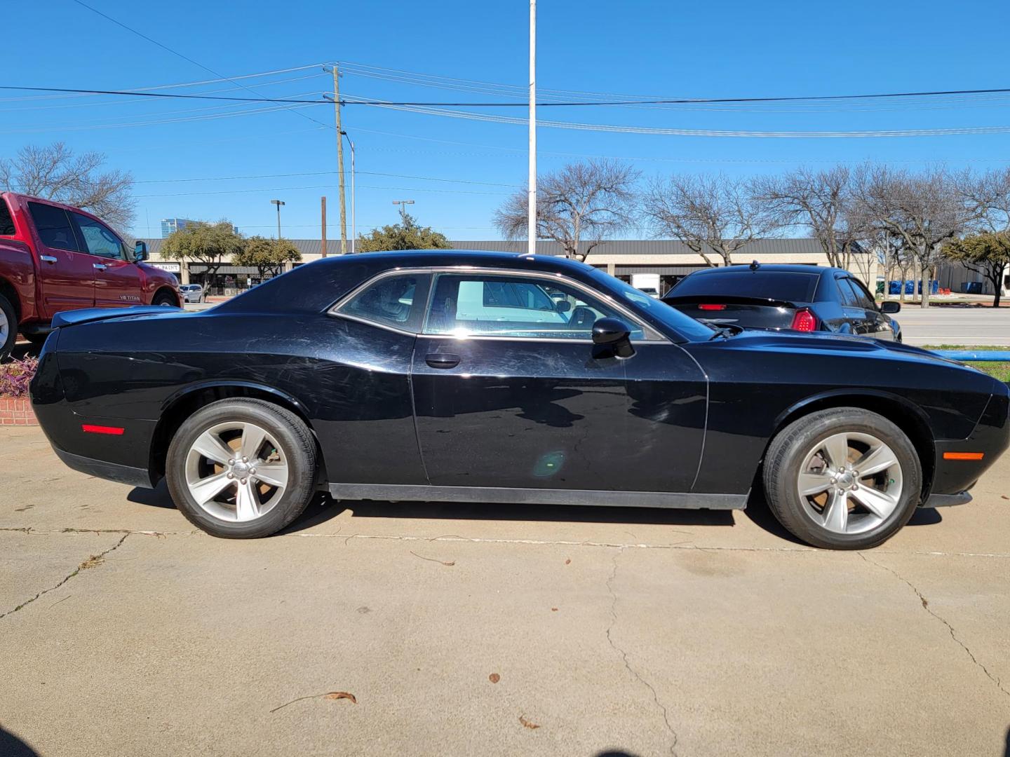 2021 Black Dodge Challenger SXT (2C3CDZAG9MH) with an 3.6L V6 DOHC 24V engine, 8A transmission, located at 2020 East Division Street, Arlington, TX, 76011, (817) 801-3191, 32.742390, -97.076874 - Photo#1